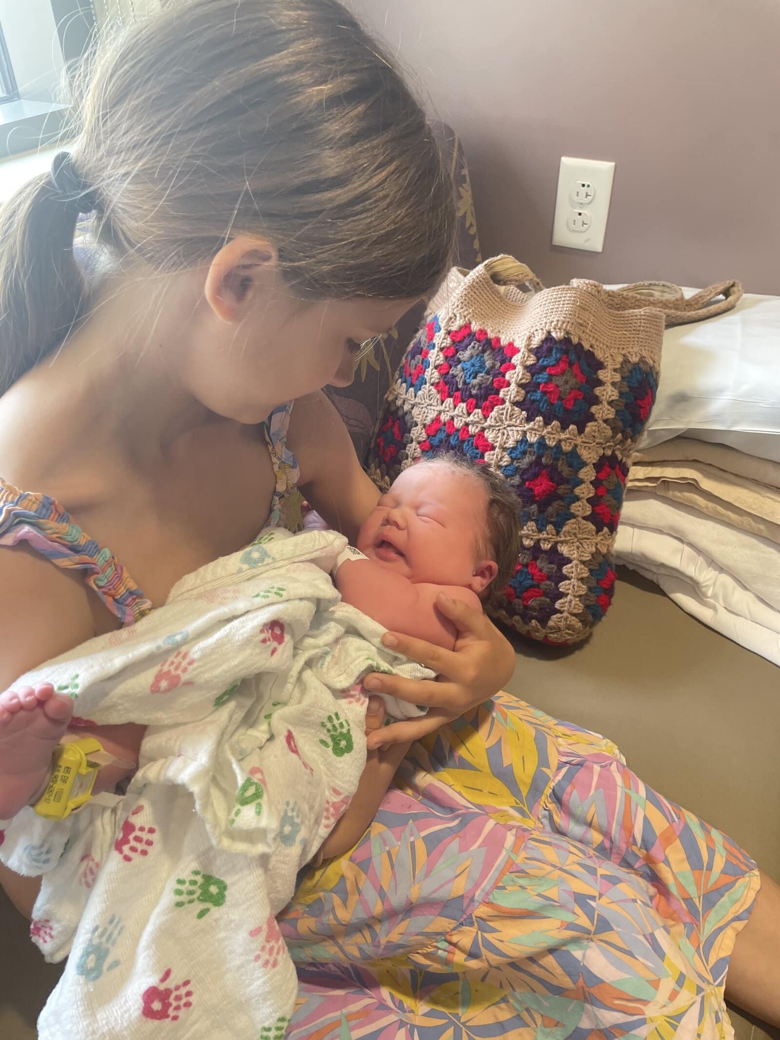 big sister holding little sister