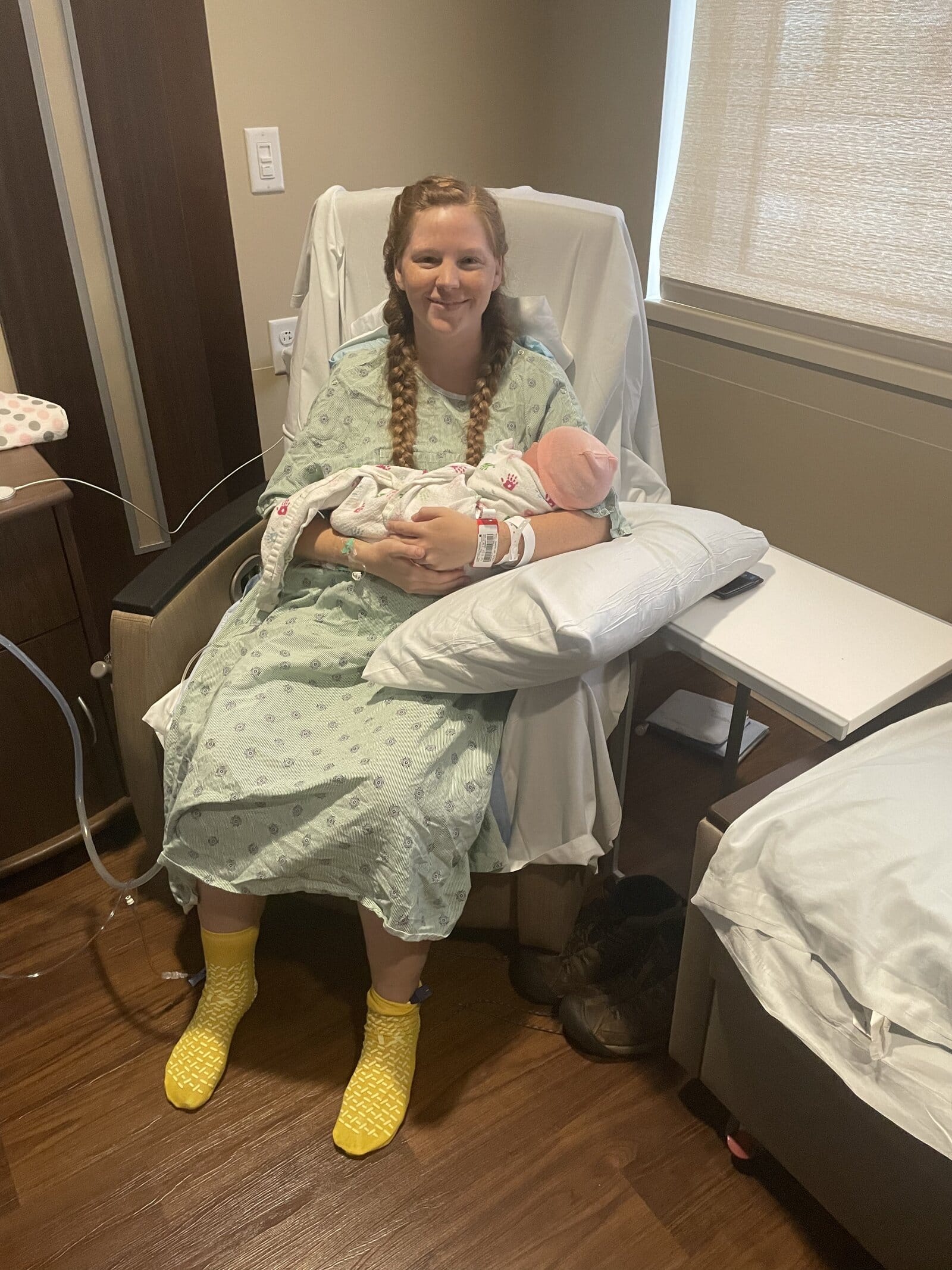 mom holding baby post c-section