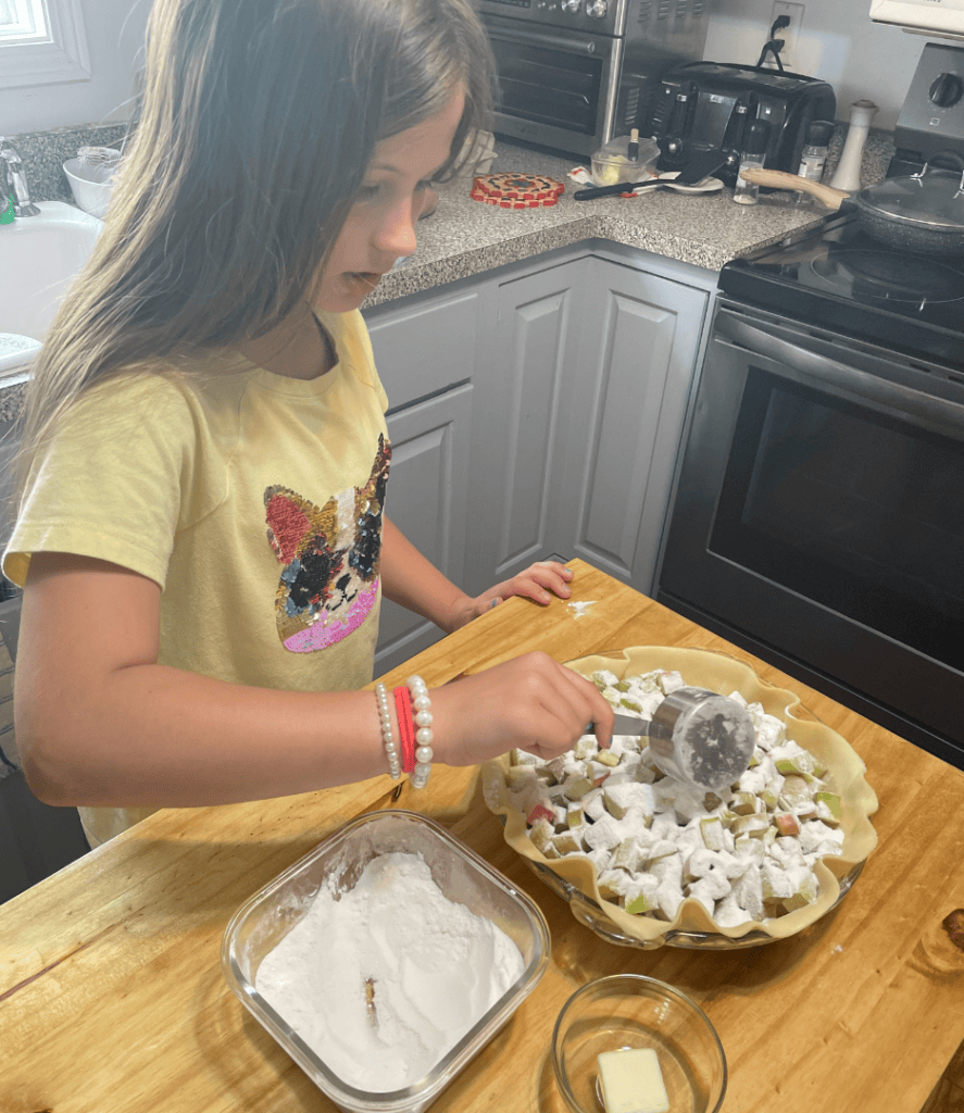 girl making rhubarb pie
