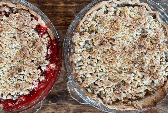 rhubarb pie and strawberry rhubarb pie with crumble tops in glass pie dish