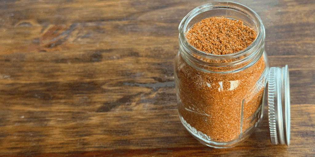 taco seasoning blend in a 4 oz spice jar with lid