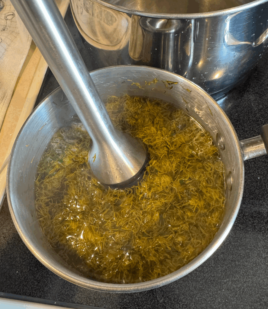immersion blender blending dandelion petals