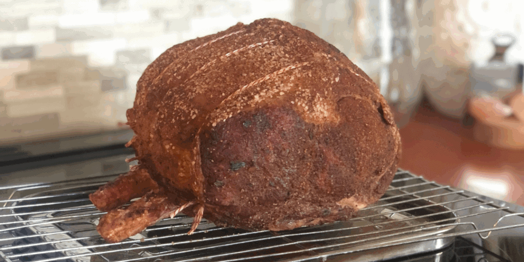 rib roast on a rack on the stove