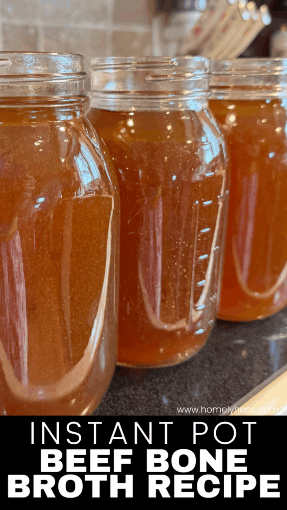 Close-up of homemade beef bone broth in glass jars cooling on the kitchen counter