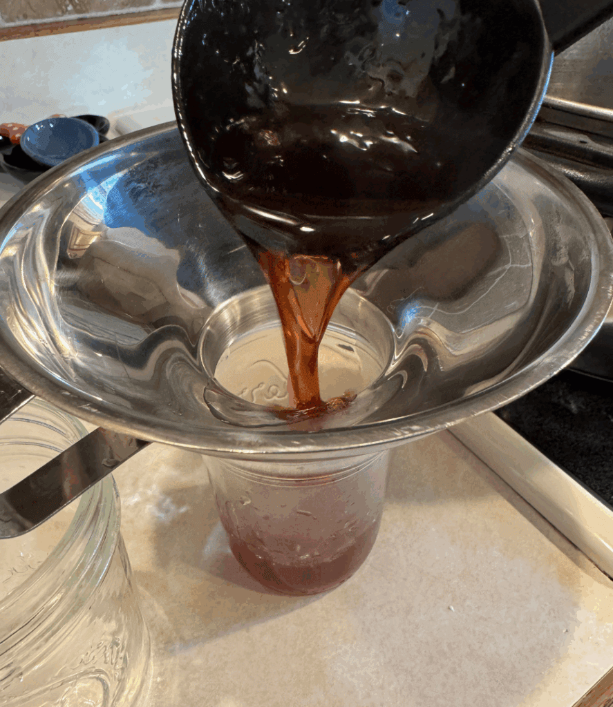 ladling jelly into jars
