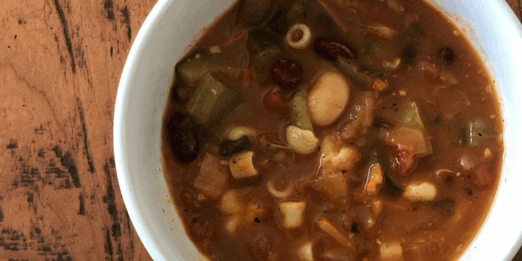 minestrone soup in a white bowl on the table