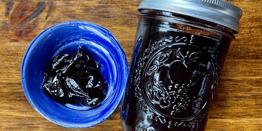 Grape jelly in a jar showing jelly that set properly