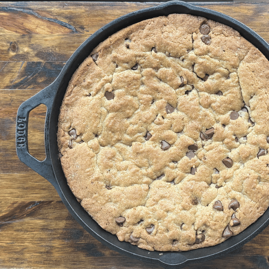 cast iron pizookie recipe on a wooden table