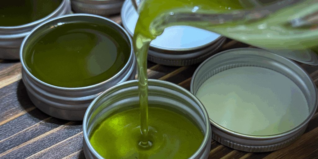 Natural cold sore salve in small tins made with lemon balm and herbal oils
