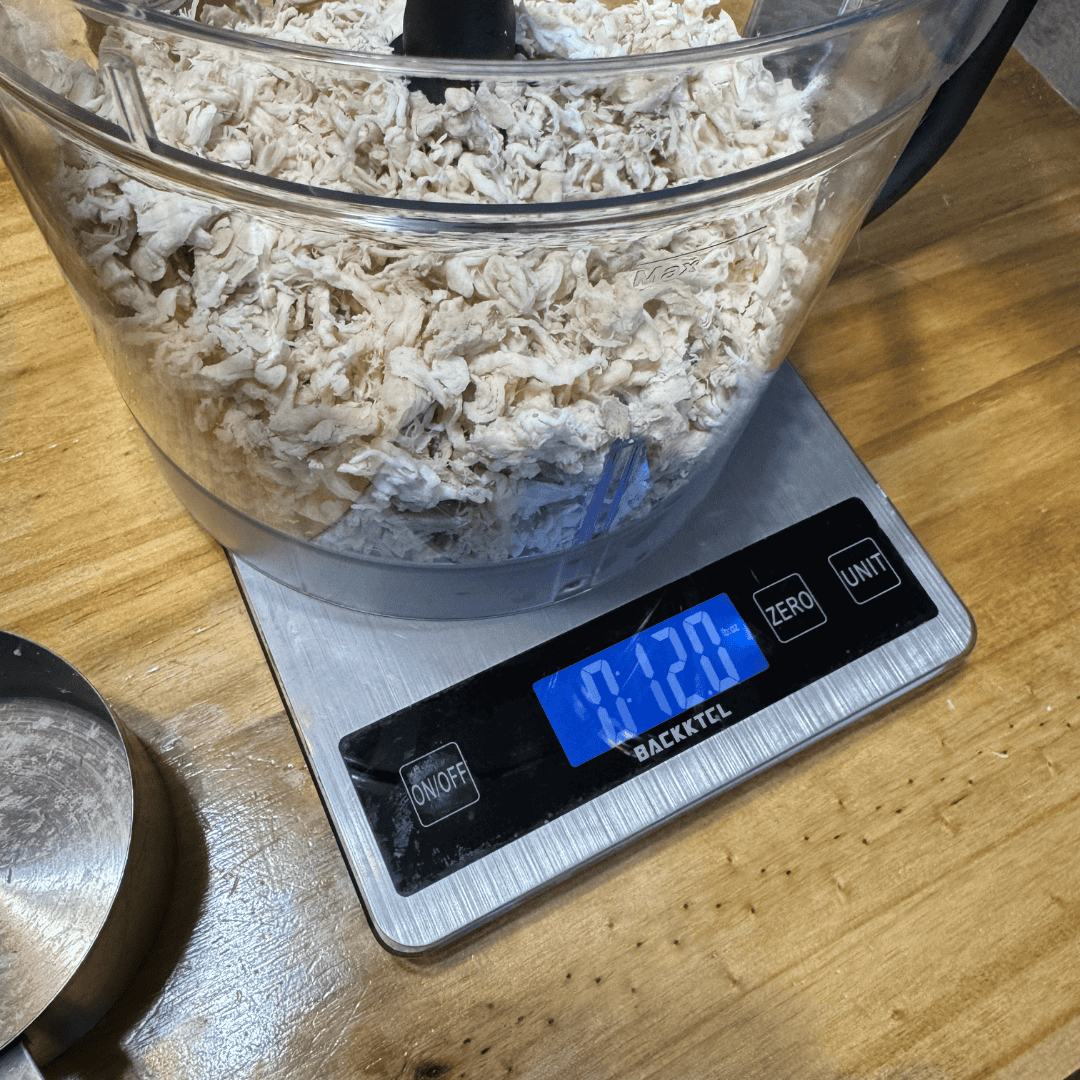 kitchen scale measuring chicken