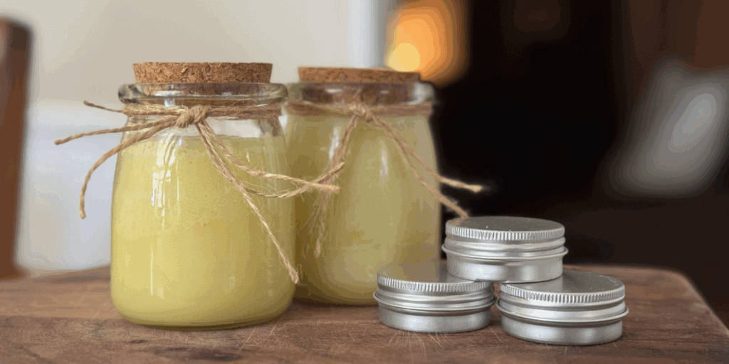 Plantain-infused salve in tins and glass jars for healing cuts, bites, and skin irritation
