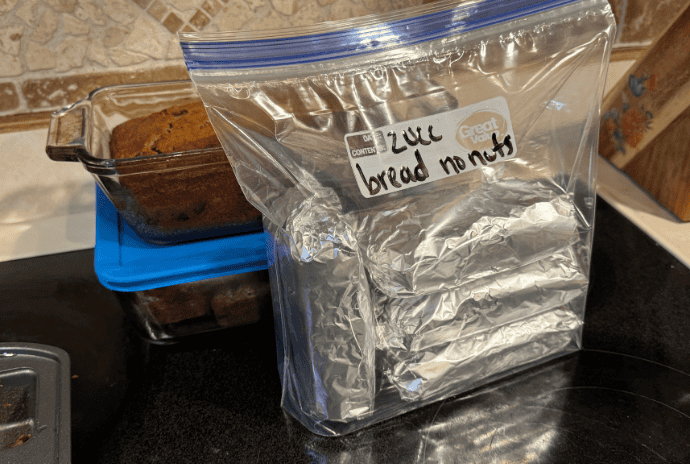 zucchini bread ready for the freezer in aluminum foil