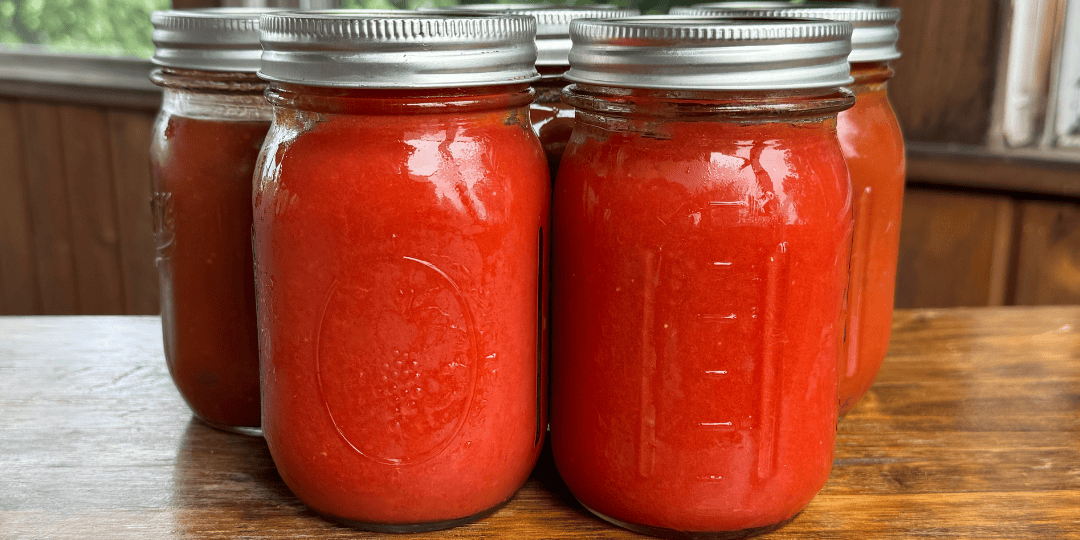 canned tomato sauce in pint jars from homegrown tomatoes