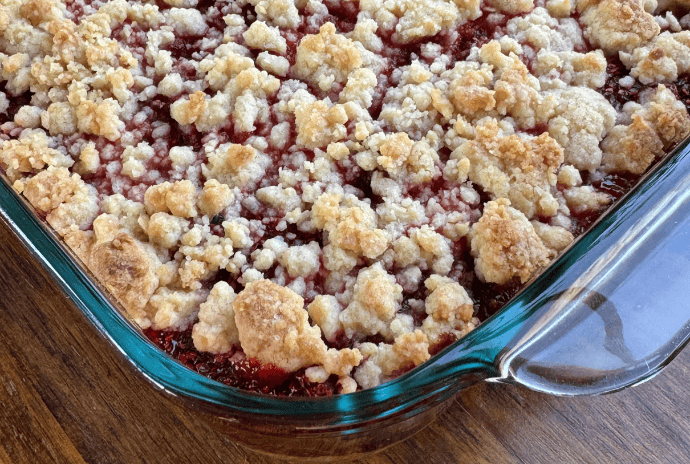 homemade thimbleberry crumble in a pyrex baking dish