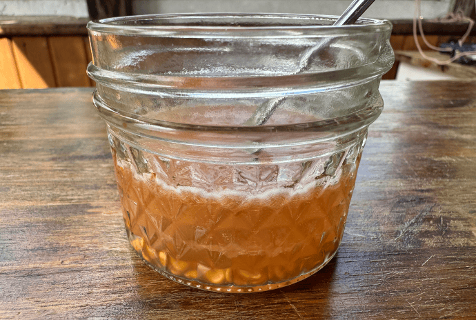 water added to freshly fermented tomato seeds