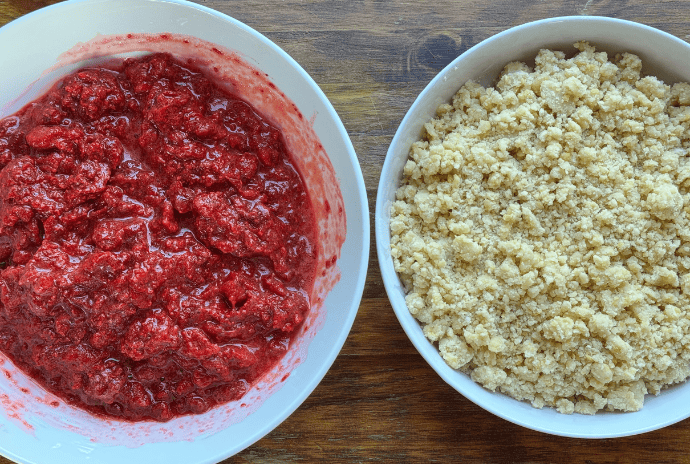 thimbleberry filling and a sugar butter crumble in separate bowls