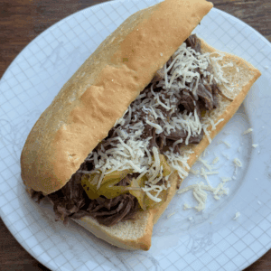 slow cooker italian beef sandwich with mozzarella cheese