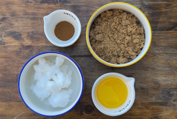 brown sugar, jojoba oil, tallow, and pumpkin spice seasoning in bowls