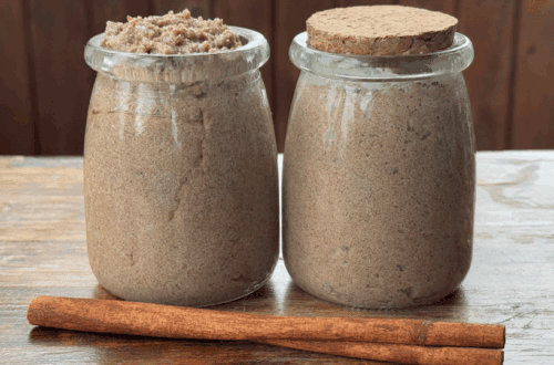 pumpkin spice tallow sugar scrub in jars with a cinnamon stick