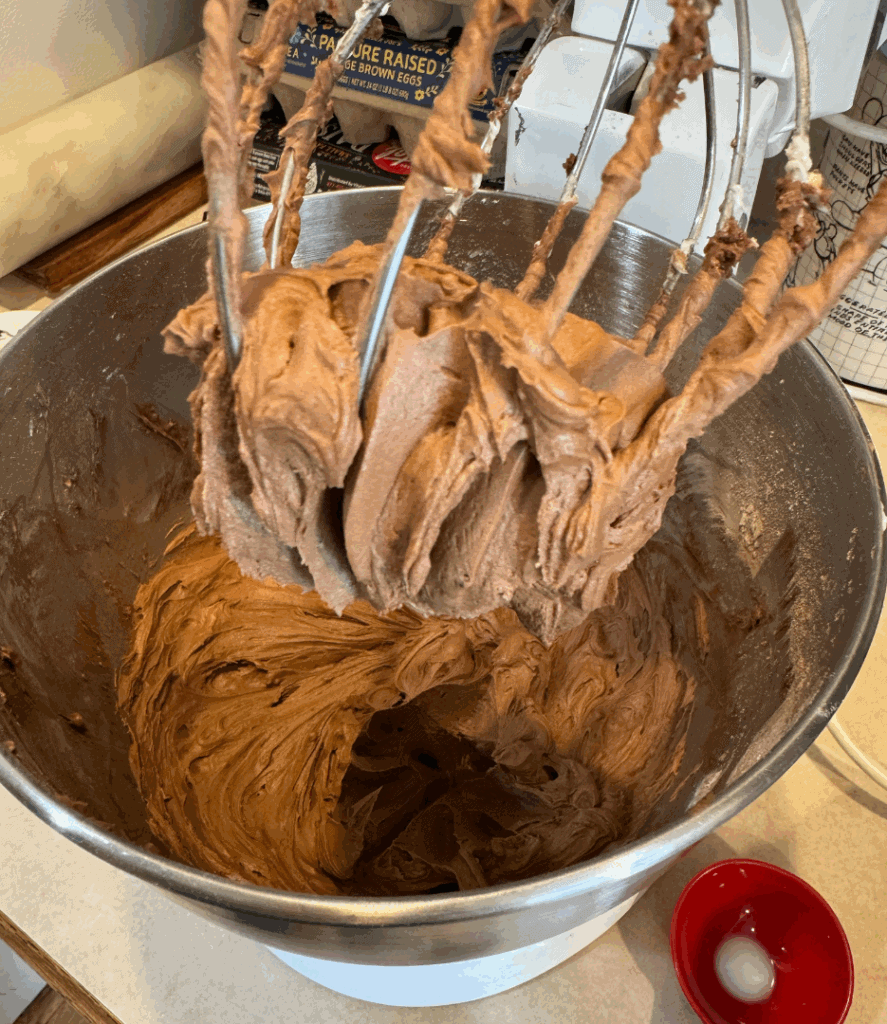 chocolate buttercream frosting on the kitchen aid mixer whisk