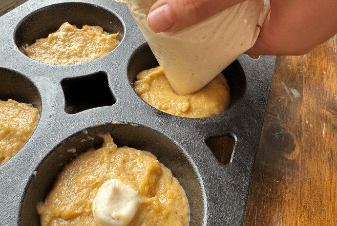 filling pumpkin muffins with cream cheese filling